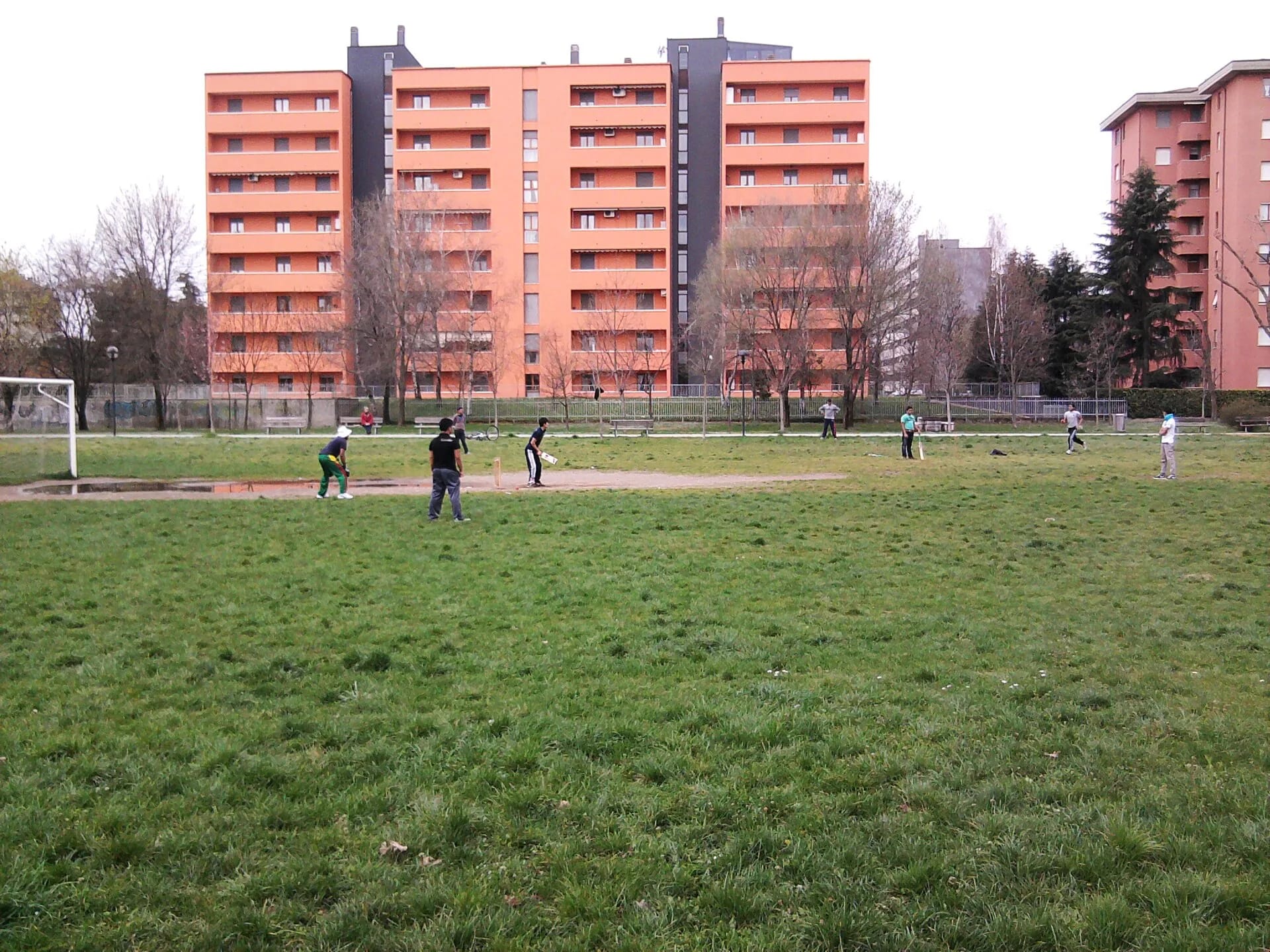 A community cricket game on a park field in Monza, just outside Milan